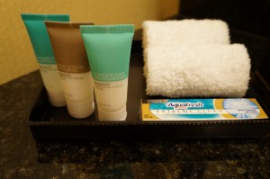a tray with a few toiletries and a towel