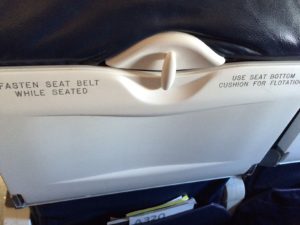 a seat belt on an airplane