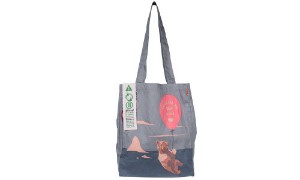 a grey tote bag with a bear on it