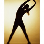 a silhouette of a woman stretching