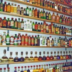 a shelf with bottles of liquor
