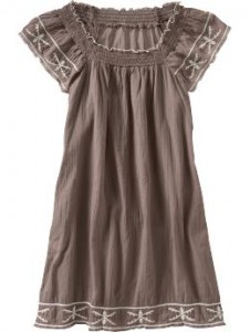 a brown dress with white embroidery
