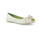 a white flat shoe with a bow
