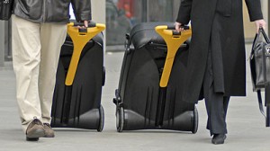 a couple of people carrying luggage