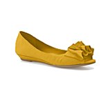 a yellow flat with a ruffle on the bottom