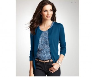 a woman in a blue cardigan