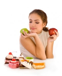 a woman holding apples and pastries