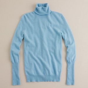 a light blue turtleneck sweater