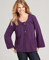 a woman in a purple sweater