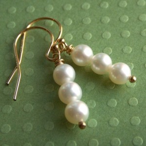 a pair of pearl earrings