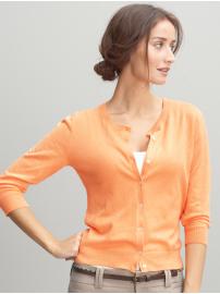 a woman in an orange sweater