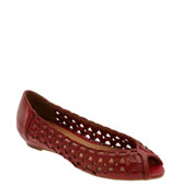 a red shoe with holes