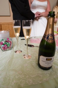 a champagne bottle and glasses on a table