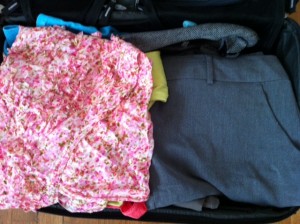 a pile of clothes in a suitcase