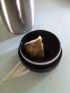 a tea bag in a black container