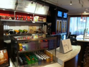 a coffee shop with a counter and drinks
