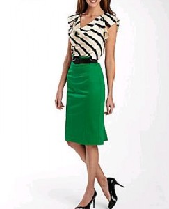 a woman in a green skirt and black shoes
