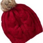 a red knit hat with a pom