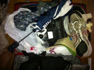 a suitcase full of clothes and shoes