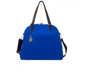 a blue handbag with black handles