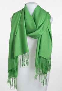 a green scarf on a mannequin