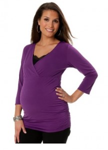 a pregnant woman in a purple top
