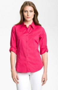 a woman in a pink shirt