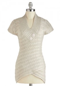 a white knitted dress on a mannequin