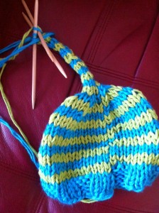 a blue and yellow knitted hat