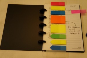 a notebook with colorful sticky notes