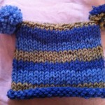 a blue and brown knit hat