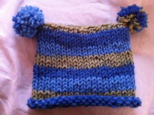 a blue and brown knit hat