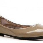 a tan flat shoe with a white background