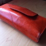 a red leather case on a table