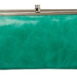 a green purse with silver metal clasp