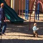 a man and child at a playground
