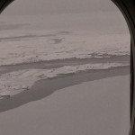 looking out of an airplane window at a frozen land