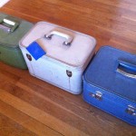 a group of suitcases on a wood floor