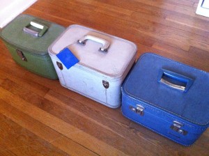 a group of suitcases on a wood floor