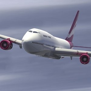 a white and pink airplane in the sky