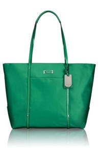 a green bag with a tag