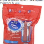 a red and white package with a toothbrush and a white and blue logo