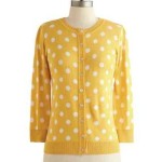 a yellow and white polka dot sweater