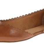 a brown leather shoe with a bow