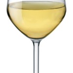 a glass of yellow liquid