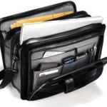 a black briefcase with a laptop and other items in it